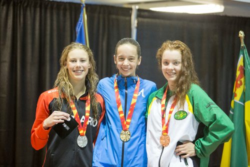 JUSTIN SAMANSKI-LANGILLE / WINNIPEG FREE PRESS
The medalists for the women's 1500m freestyle pose one the podium with their medals. From left: Kenna Smallegange, Ont., Emma O'Croinin, Alta., Rebecca Lou Dean, Sask. 
170807 - Monday, August 07, 2017.