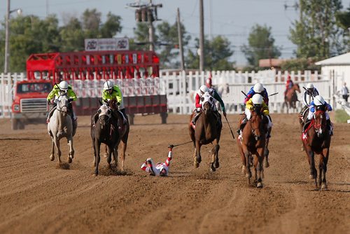 JOHN WOODS / WINNIPEG FREE PRESS
Rohan Singh comes off Coors Lute (2) as Plentiful (1) leads uo the final stretch in the running of the Manitoba Derby at Assiniboia Downs Monday, August 7, 2017.