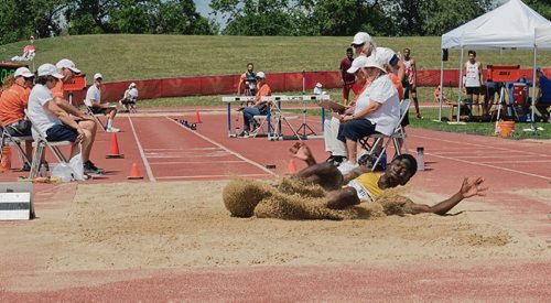 Canstar Community News Aug. 1, 2017 - William Nti, a long jumper with Team Manitoba, lands in the pit during the preliminary jumps on Aug. 1 at University Stadium at the U of M. Nti's best jump was 7.01 meters and placed fourth after the first round. (DANIELLE DA SILVA/CANSTAR/SOUWESTER)