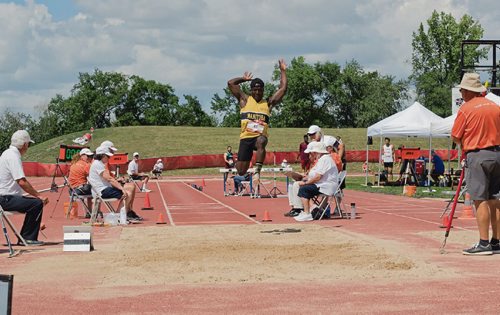 Canstar Community News Aug. 1, 2017 - William Nti, a long jumper with Team Manitoba, lands in the pit during the preliminary jumps on Aug. 1 at University Stadium at the U of M. Nti's best jump was 7.01 meters and placed fourth after the first round. (DANIELLE DA SILVA/CANSTAR/SOUWESTER)