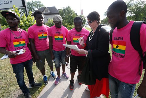 JOHN WOODS / WINNIPEG FREE PRESS
Senator and Global College Professor Marilou McPhedran signs a petition outside the the Caribbean Pavilion calling on the Ghanaian government to change their ant-LGBTQ policies Tuesday, August 8, 2017. McPhedran brings her Human Rights UniverCity students on a bus to the Caribbean Pavilionand and will discuss in their classroom the Ghanaian petitioners who have been gathered outside the pavilion collecting signatures calling on the Ghanaian government to change their ant-LGBTQ policies.