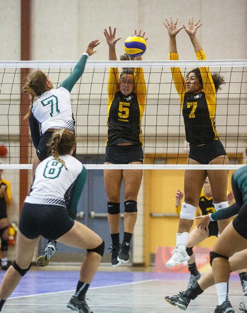 MIKE DEAL / WINNIPEG FREE PRESS
Team Manitoba women's volleyball team plays against Team PEI Wednesday afternoon at Investors Group Athletics Centre.
Manitoba' Julia Tays (5) and Laura Hill (7) leap to block a shot by PEI' Mary Lowther (7) during game action.
170809 - Wednesday, August 09, 2017.