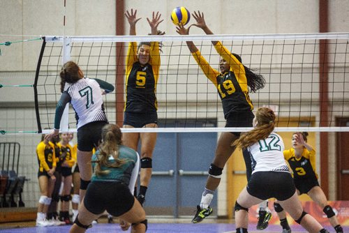 MIKE DEAL / WINNIPEG FREE PRESS
Team Manitoba women's volleyball team plays against Team PEI Wednesday afternoon at Investors Group Athletics Centre.
Manitoba' Julia Tays (5) and Light Uchechukwu (19) leap to block a shot by PEI' Mary Lowther (7) during game action.
170809 - Wednesday, August 09, 2017.