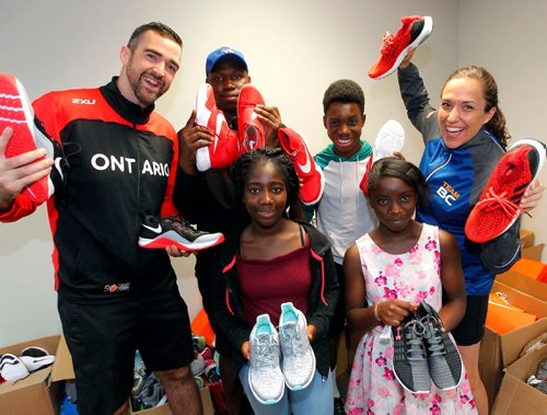 BORIS MINKEVICH / WINNIPEG FREE PRESS
Team BC and Team Ontario joined forces to support the Boys and Girls Clubs of Winnipeg. Leading up to the 2017 Canada Summer Games, the two teams collected donations of new or gently used running shoes to help give more children the opportunity to participate in physical activity or sport through the Boys and Girls Clubs programs. From left front, Faith Odunayo,14 and Dupe Abajesude,11, From left-back, Team Ontario Assistant Chef de Mission Nick Snow, Emmanuel Olugbodi,15, Feranmi Adebiyi,16, and  Team BC Assistant Chef de Mission Michelle Collens. August 10, 2017