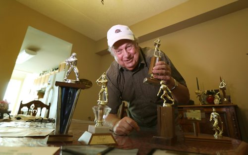 RUTH BONNEVILLE / WINNIPEG FREE PRESS

Ernie Peters (79yrs), a pitcher on Manitoba's softball team at the very first Canada Summer Games which was held in Nova Scotia in 1969, is attending tonights Manitoba vs. New Brunswick game. 
Photos of him with trophies and memorabilia including a photo of him with his teammates at his home.
See Keila Depape story.  

Aug 10,, 2017