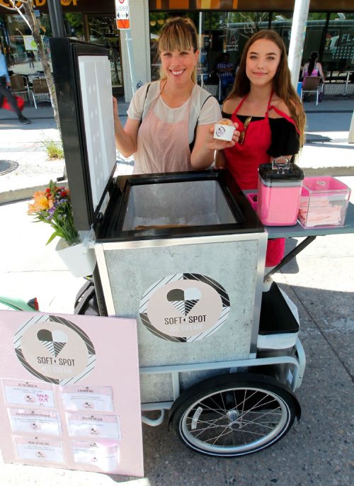 BORIS MINKEVICH / WINNIPEG FREE PRESS
SOFT SPOT ICE CREAM - Amelia Giesbrecht, left, has an old-fashioned bicycle with a refrigerated unit attached that she sells her ice cream out of at the Hydro Building Farmers Market. Athena Giesbrecht, right, is her assistant. August 10, 2017