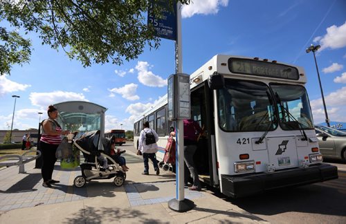 TREVOR HAGAN / WINNIPEG FREE PRESS 
Buses in front of transit stop #20245 in the Unicity Mall parking lot, Friday, August 11, 2017.