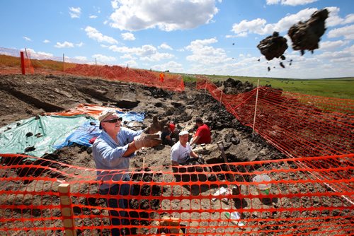 WAYNE GLOWACKI / WINNIPEG FREE PRESS

Bob Kitlar with the Mineral Society of Manitoba tosses out clay in the search of selenite crystal in the clay in the Floodway Friday. The Mineral Society of Manitoba has been given special permission to dig in the Red River Floodway in east side of Winnipeg for Selenite crystals.   Kevin Rollason story   August 11 2017