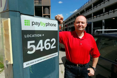 BORIS MINKEVICH / WINNIPEG FREE PRESS
Colin Stewart, policy analyst, Winnipeg Parking Authority poses at a parking pay station near the University of Winnipeg. August 11, 2017