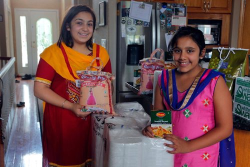 BORIS MINKEVICH / WINNIPEG FREE PRESS
From left, Sisters Simryn Singh,15, and Jasmyn Singh,11,
The two sisters tarted a local charity organization to feed the homeless. They'll be serving between 600 to 800 meals at a charity event tomorrow. August 11, 2017