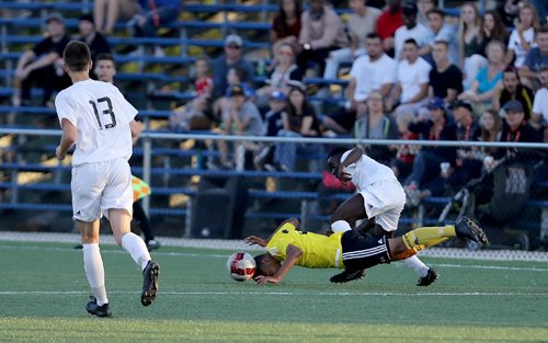 TREVOR HAGAN / WINNIPEG FREE PRESS
Team Manitoba's Joseph Cannizzaro dives to head the ball as he battles with Team Alberta's Abraham Dukuly during their soccer match, Friday, August 11, 2017.