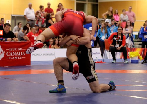 TREVOR HAGAN / WINNIPEG FREE PRESS
Hunter Lee of Manitoba, bottom lifting Kyle Jordon of Ontario for gold in the mens 98kg wrestling division, Friday, August 11, 2017.