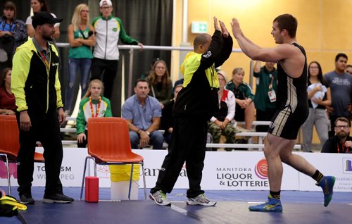 TREVOR HAGAN / WINNIPEG FREE PRESS
Hunter Lee of Manitoba, right, celebrating after defeating Kyle Jordon of Ontario for gold in the mens 98kg wrestling division, Friday, August 11, 2017.