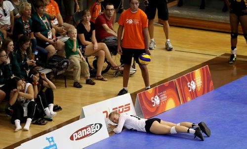 TREVOR HAGAN / WINNIPEG FREE PRESS
Team Manitoba's Jessica Andjelic tries to save a ball and slides through a barrier while playing against Alberta on the way to winning volleyball gold at the Canada Summer games, Saturday, August 12, 2017.