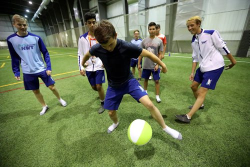 TREVOR HAGAN / WINNIPEG FREE PRESS
Darien Comin, middle, and his NWT Soccer teammates kill time in the soccer complex while waiting for the rest of the Canada Summer Games athletes to converge before closing ceremonies at Investors Group Field, Sunday, August 13, 2017.