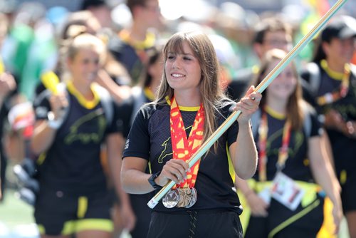 TREVOR HAGAN / WINNIPEG FREE PRESS
Team Manitoba's Maddy Mitchell carries the flag for Team Manitoba at the Canada Summer Games closing ceremonies, Sunday, August 13, 2017.