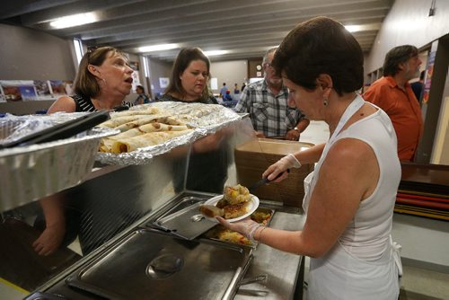 JOHN WOODS / WINNIPEG FREE PRESS
People are served at the Serbian "Kolo" pavilion Monday, August 13, 2017.