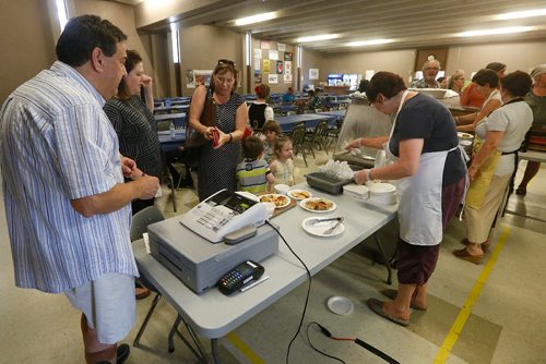 JOHN WOODS / WINNIPEG FREE PRESS
People are served at the Serbian "Kolo" pavilion Monday, August 13, 2017.
Folklorama 2nd week, 2017