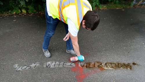 WAYNE GLOWACKI / WINNIPEG FREE PRESS

Brennan Dugas with Take Pride Winnipeg was part of a crew removing  graffiti on Wellington Crescent and Omand Park area Wednesday morning. Here he is cleaning up an offensive message and bad spelling on the sidewalk on the Omands Creek Greenway at the foot of the bridge over the Assiniboine River.  August 16 2017