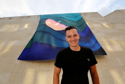 JUSTIN SAMANSKI-LANGILLE / WINNIPEG FREE PRESS
Local artist Kenneth Lavallee poses in front of his Creation Story, which was installed on the side of the Winnipeg Art Gallery Wednesday evening as part of the upcoming INSURGENCE/RESURGENCE exhibition, which opens Sept. 22.
170816 - Wednesday, August 16, 2017.