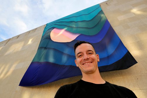 JUSTIN SAMANSKI-LANGILLE / WINNIPEG FREE PRESS
Local artist Kenneth Lavallee poses in front of his Creation Story, which was installed on the side of the Winnipeg Art Gallery Wednesday evening as part of the upcoming INSURGENCE/RESURGENCE exhibition, which opens Sept. 22.
170816 - Wednesday, August 16, 2017.