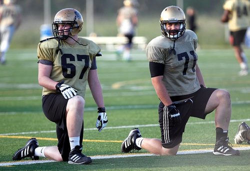 PHIL HOSSACK / WINNIPEG FREE PRESS - Linemen Matt Clarkson (left) and brother Tom at a Bison workout Wednesday.  - . See Taylor's story.  - August 16, 2017
