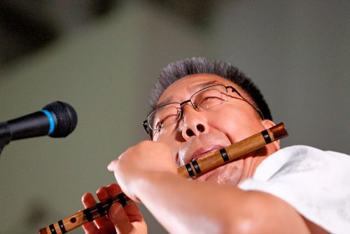 JUSTIN SAMANSKI-LANGILLE / WINNIPEG FREE PRESS
A local artist performs a traditional flute song Wednesday at the Indochina Chinese Folklorama Pavillion.
170816 - Wednesday, August 16, 2017.