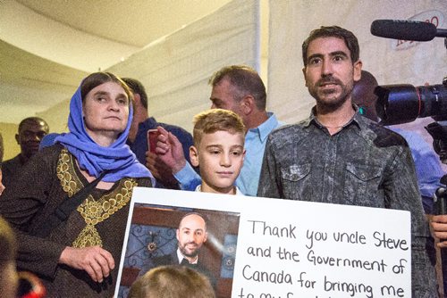 JUSTIN SAMANSKI-LANGILLE / WINNIPEG FREE PRESS
Emad Mishko Tamo, 12, centre, his mother Nofa Mihlo Rafo, left, and uncle Hadji Tamo walk out of a private room in Winnipeg's James Armstrong Richardson International Airport Thursday after Emad was freed from ISIS captivity and returned to his family in Winnipeg.
170817 - Thursday, August 17, 2017.