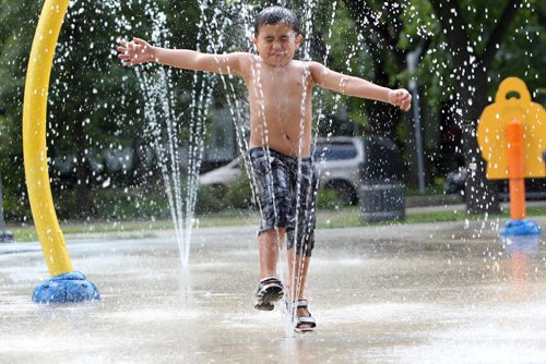 RUTH / BONNEVILLE WINNIPEG FREE PRESS

Riley Funk (4yrs) cools himself in the spray shower at Provencher Spray Pad Thursday afternoon.  
Standup photo 

Aug 17, 2017
