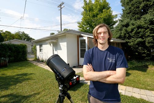 JUSTIN SAMANSKI-LANGILLE / WINNIPEG FREE PRESS
Brenden Petracek, president of the Winnipeg chapter of the Royal Astronomical Society of Canada poses with one of his telescopes Thursday. 
170817 - Thursday, August 17, 2017.