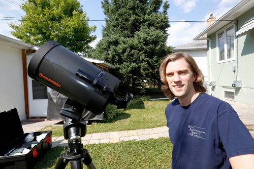 JUSTIN SAMANSKI-LANGILLE / WINNIPEG FREE PRESS
Brenden Petracek, president of the Winnipeg chapter of the Royal Astronomical Society of Canada poses with one of his telescopes Thursday. 
170817 - Thursday, August 17, 2017.