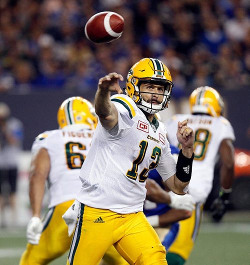 PHIL HOSSACK / WINNIPEG FREE PRESS  - Edmonton Eskimo quarter back #13 Mike Reilly lets loose another pass attempt in the 4th quarter at Investor Group Stadium Thursday.  - August 17, 2017