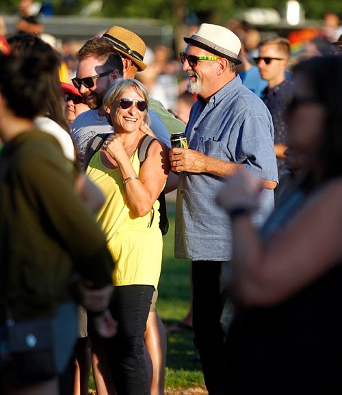PHIL HOSSACK / WINNIPEG FREE PRESS  - Long time festival goers Monique Boulet and her husband Ken Green enjoy Yola Carter on her first Canadian tour stop wow the crowd at Interstellar Rodeo's opener Friday night for the weekend festival at the Forks. - August 17, 2017
