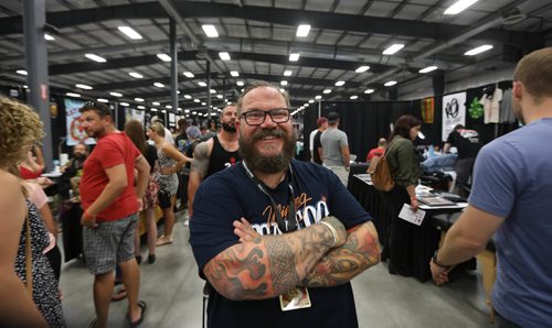 Ruth Bonneville / Winnipeg Free Press 


Photo of Rich Handford organizer for the inaugural Winnipeg Tattoo Convention looks over the crowd of people attending the event  at Red River Exhibition Park Saturday.  The three-day event is billed as a "celebration of tattoo art, culture, craftsmanship and self-expression and features more than 200 artists.
See Randy Turner's story to run Monday.  
Aug 19, 2017
