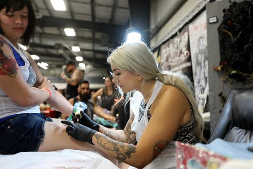 Ruth Bonneville / Winnipeg Free Press 


Tattooer Jennah Bullaro works on a Pokeman tattoo on a women's leg  at the inaugural Winnipeg Tattoo Convention Saturday, on all weekend,  at Red River Exhibition Park. The three-day event is billed as a "celebration of tattoo art, culture, craftsmanship and self-expression and features more than 200 artists.
For Randy's story running Monday, Aug 21st.  
Aug 19, 2017