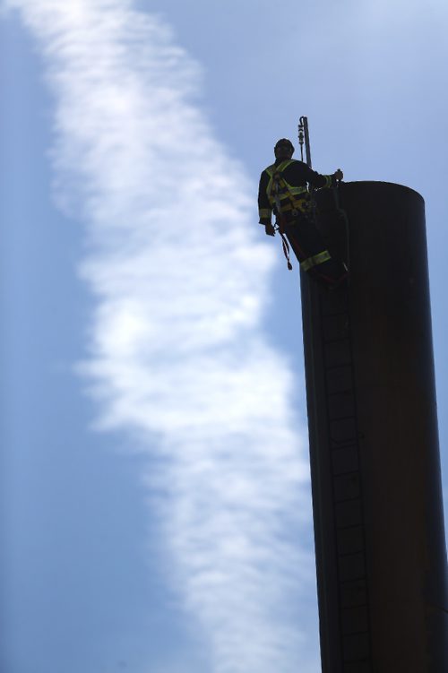 TREVOR HAGAN / WINNIPEG FREE PRESS
Steve Kelland of McLean Chimney Company, working on the chimney above a boiler near the St.Boniface Museum, Sunday, August 20, 2017.