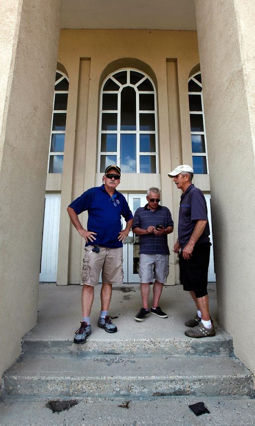 PHIL HOSSACK / WINNIPEG FREE PRESS  - Left to right, Dave Stubbert, Ed Bonin and Cecil Boulter gather in front of a barrack at CFB Kapyong. About 25 vets came "home" for a last look at the soon to be demolished former Military base. None of the vets were allowed into the bases buildings. See Melissa Martin story. - August 21, 2017