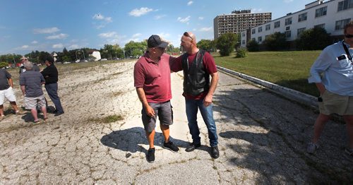 PHIL HOSSACK / WINNIPEG FREE PRESS  - Left to right, Huff Mullick and Benny Grant reunite on the parade ground at CFB Kapyong. About 25 vets came "home" for a last look at the soon to be demolished former Military base. None of the vets were allowed into the bases buildings. See Melissa Martin story. - August 21, 2017