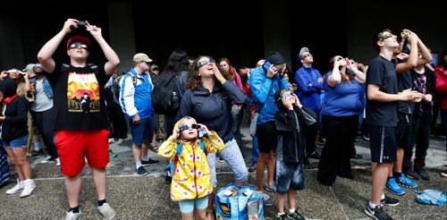 WAYNE GLOWACKI / WINNIPEG FREE PRESS

The gathering outside the Manitoba Museum got glimpses of¤the partial eclipse through clouds¤ Monday. Keila DePape story  August 21 2017