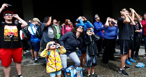 WAYNE GLOWACKI / WINNIPEG FREE PRESS

The gathering outside the Manitoba Museum got glimpses of¤the partial eclipse through clouds¤ Monday. Keila DePape story  August 21 2017