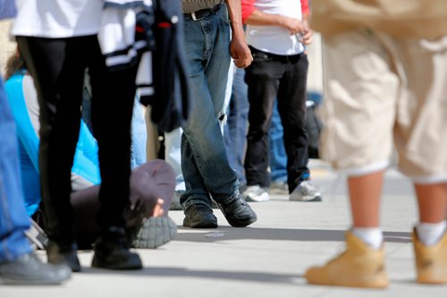 JUSTIN SAMANSKI-LANGILLE / WINNIPEG FREE PRESS
People line up in front of the Siloam Mission Tuesday for the lunchtime meal service.
170822 - Tuesday, August 22, 2017.