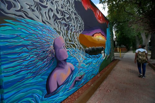 WAYNE GLOWACKI / WINNIPEG FREE PRESS

The mural titled O Kanata on the side of Y-Not Foods at 501 Ellice Ave. at Spence St. by artists Annie Beach and Brianna Wentz. The mural created  to honour Canada on its 150th anniversary of Confederation was unveiled Tuesday morning.  August 22 2017
