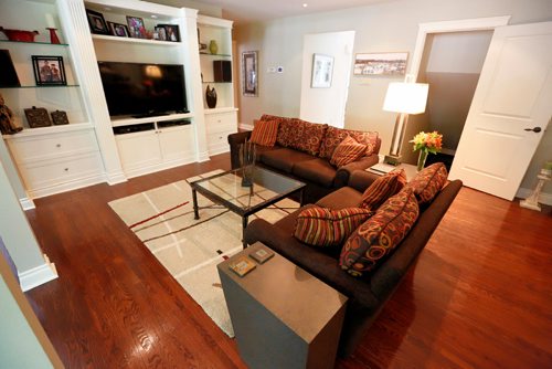 JUSTIN SAMANSKI-LANGILLE / WINNIPEG FREE PRESS
The family room of 59 Salme has access to the basement, patio, kitchen and a sunroom/dining room.
170822 - Tuesday, August 22, 2017.