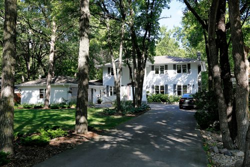 JUSTIN SAMANSKI-LANGILLE / WINNIPEG FREE PRESS
The front yard of 59 Salme includes a large lawn, driveway and two car garage.
170822 - Tuesday, August 22, 2017.