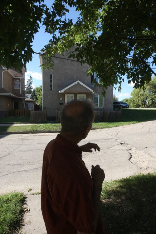 JOE BRYKSA / WINNIPEG FREE PRESSPoint Douglas activist Sel Burrows shows a rooming house across the street from his house that was a challenge when he first moved in -Aug 03, 2017 -( See Randy Turners 49.8  story)