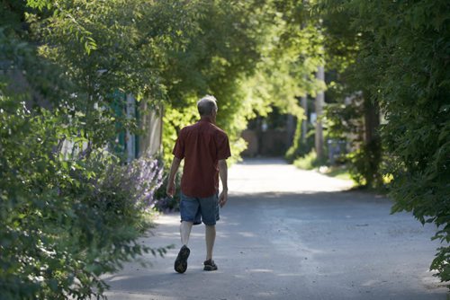 JOE BRYKSA / WINNIPEG FREE PRESSSel Burrows walks down backlane in Point Douglas-- Aug 03, 2017-( See Randy Turners 49.8  story)