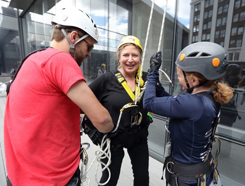 JASON HALSTEAD / WINNIPEG FREE PRESS

Deborah Gural smiles after taking her turn at the 13th annual Easter Seals Drop Zone in support of children, youth and adults with disabilities in Manitoba at the Manitoba Hydro Building in Downtown Winnipeg on Aug. 22, 2017. Peter Hampton and Erica Veenstra of Vertical Adventures were helping Gural get unhooked. (See Social Page)