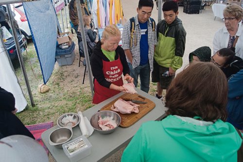 Canstar Community News Those who attended the St. Norbert Farmers' Market second annual farmer's festival enjoyed insights into local food production and picked up tips from local producers, such as how to break down a whole chicken.  (DANIELLE DA SILVA/CANSTAR/SOUWESTER)