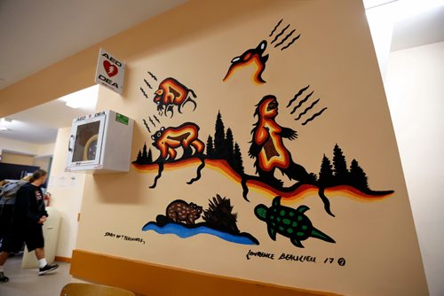 JUSTIN SAMANSKI-LANGILLE / WINNIPEG FREE PRESS
'Spirit of 7 Teachings,' by Lawrence Beaulieu is seen as a work in progress Wednesday on the main floor of the Ma Mawi Wi Chi Itata Centre. The mural, created with acrylic paints, represents the seven sacred teachings focusing on love and courage. 
170823 - Wednesday, August 23, 2017.