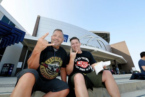 JUSTIN SAMANSKI-LANGILLE / WINNIPEG FREE PRESS
David Wrolstad and his son Aaron, from North Dakota, pose in front of Investors Group Field Thursday before the Guns N' Roses concert.
170824 - Thursday, August 24, 2017.